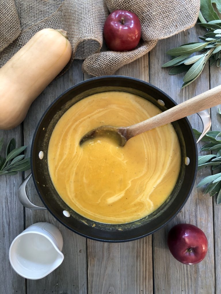 stirring coconut milk in soup