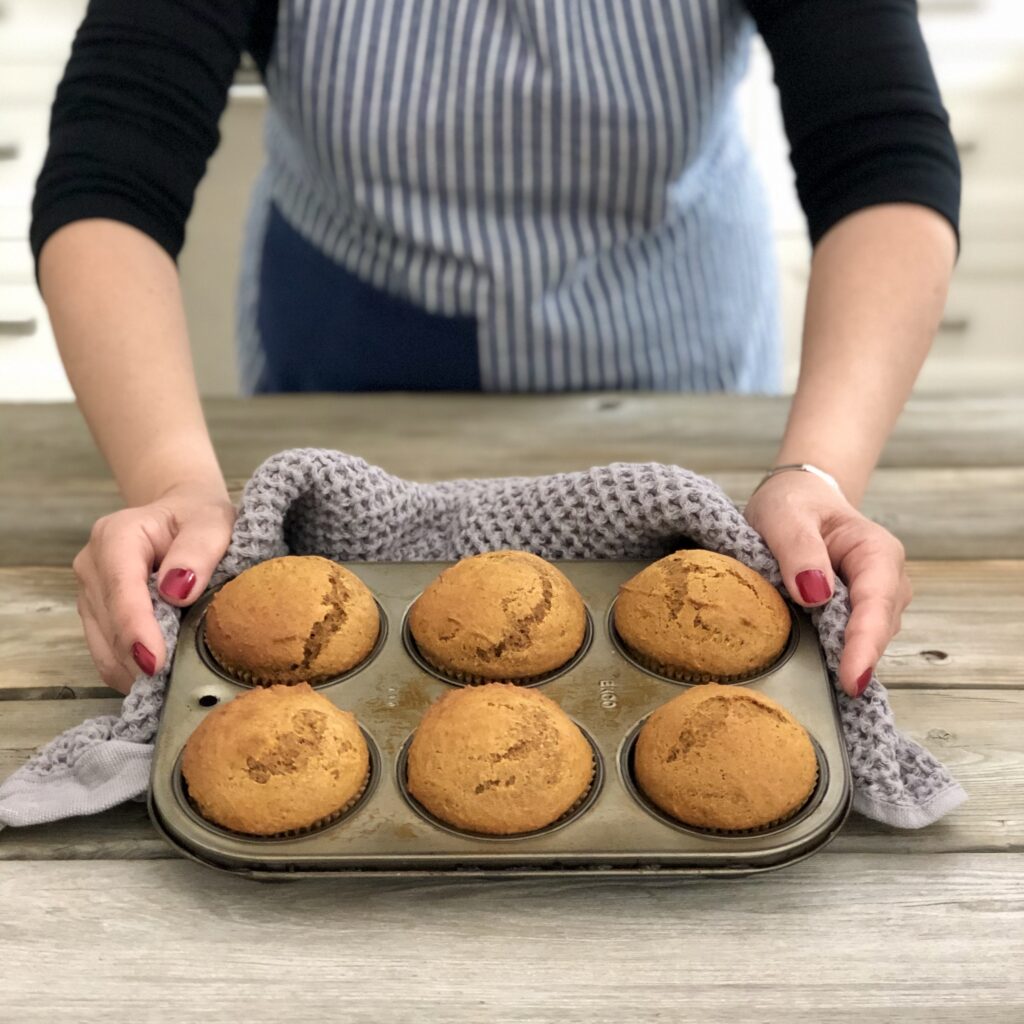 Woman holding muffin tin