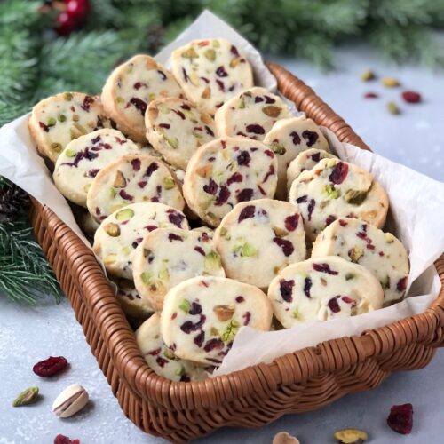 Basket of shortbread with cranberries and pistachios.