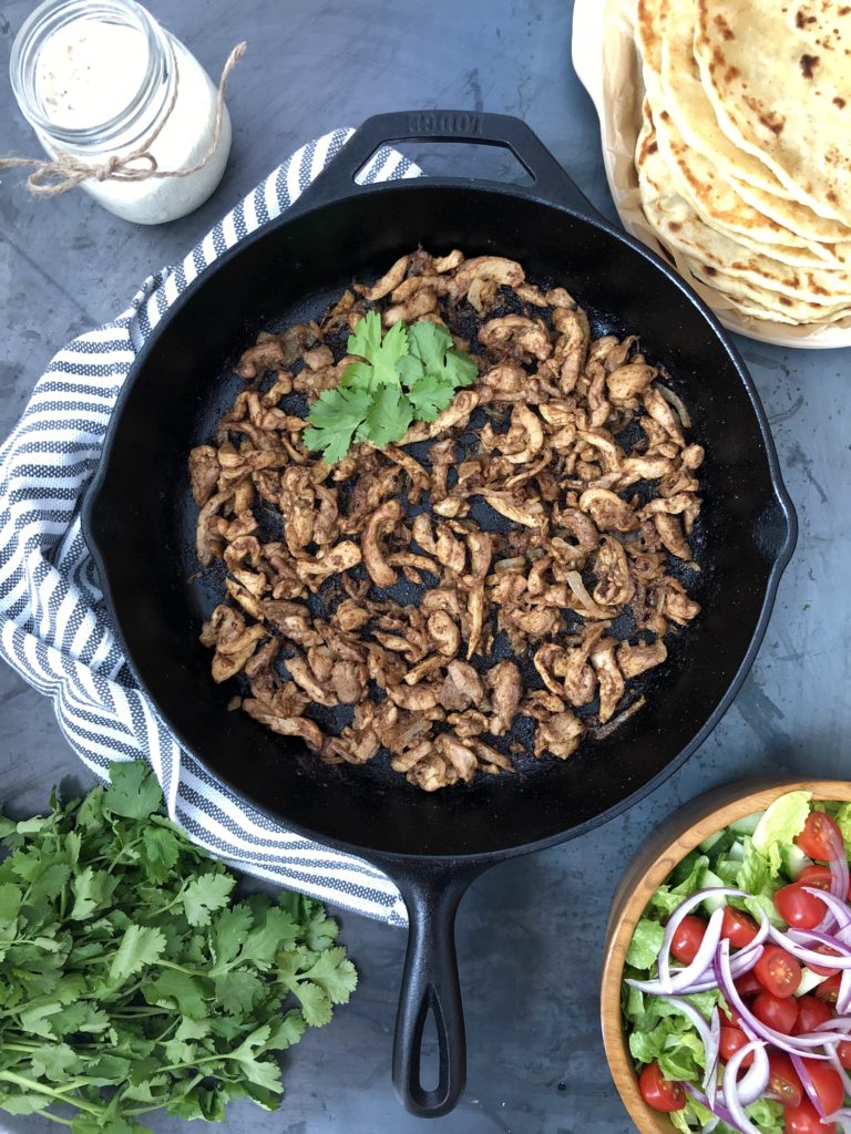 chicken shawarma cooking in skillet