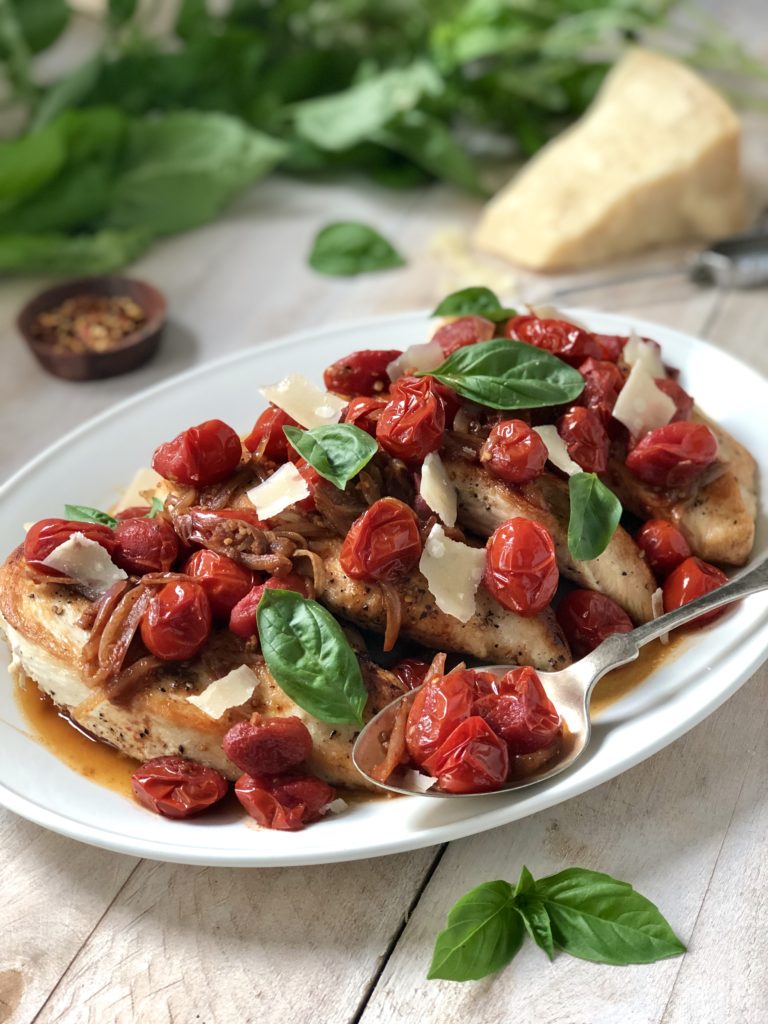 Serving plate of chicken with balsamic cherry tomatoes