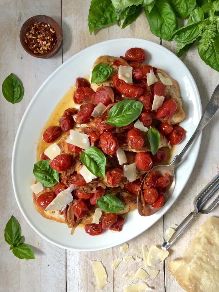 Flatlay of chickcen with balsamic cherry tomatoes