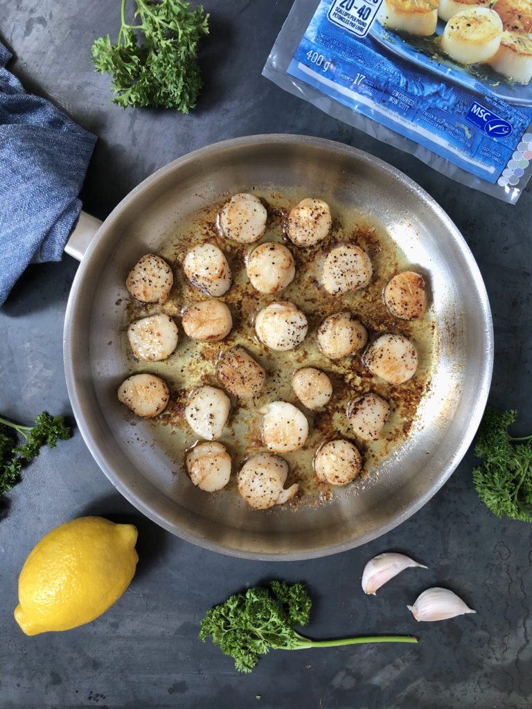 Seared scallops in frying pan