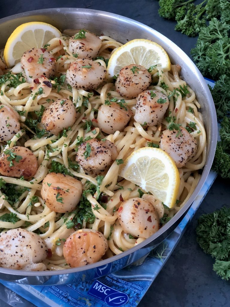 Cooked scallops in pan