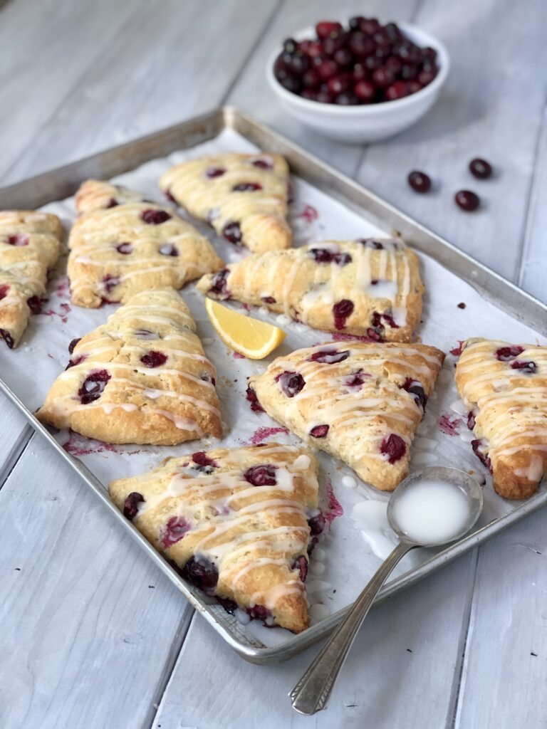 Cranberry scones drizzled with lemon glaze.