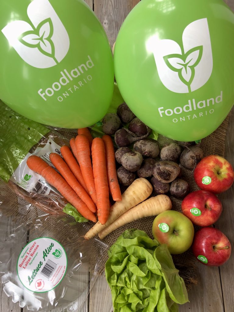 Green and white Foodland Ontario logo with assorted vegetables