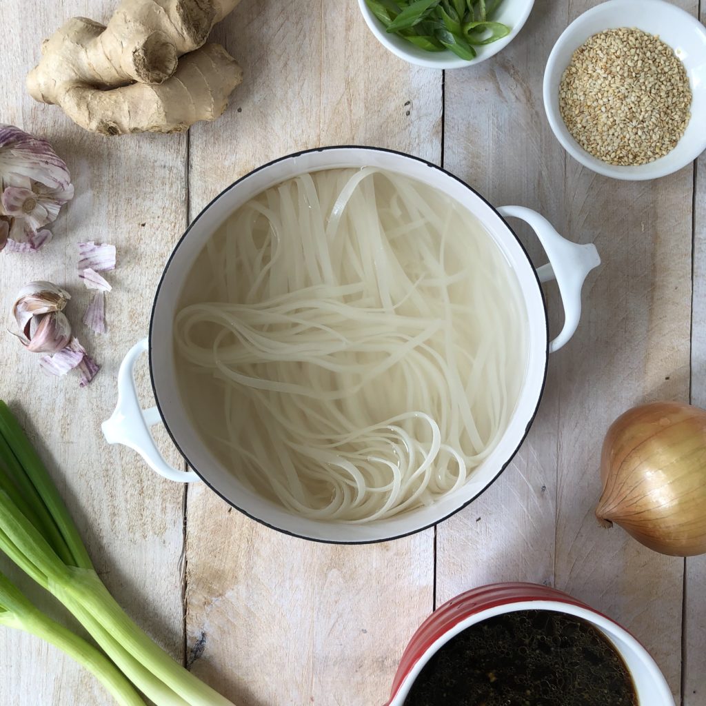 Cooking rice noodles in a pot