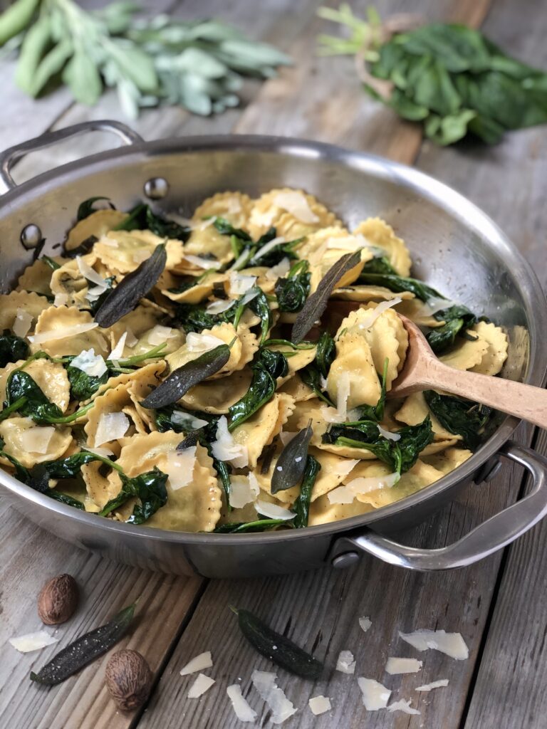 Stirring pasta in a skillet