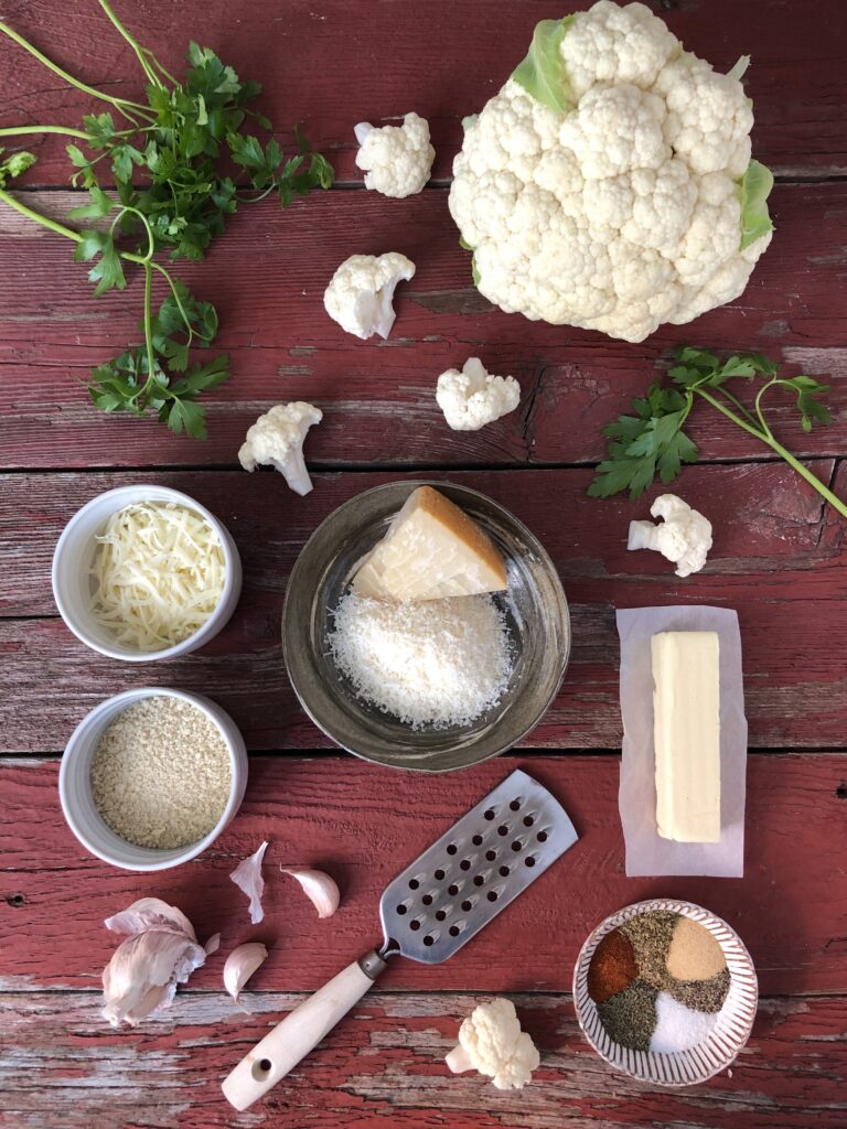 Cauliflower and other ingredients laid out on table
