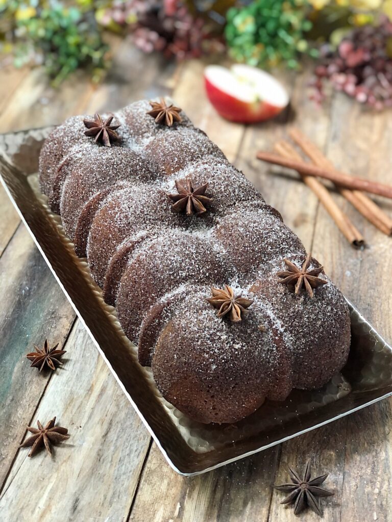 Whole apple donut cake on a platter.