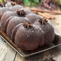 Cider donut cake on a plate with anise