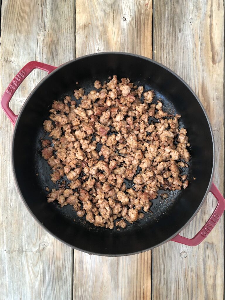 Skillet with cooked browned sausage crumbles