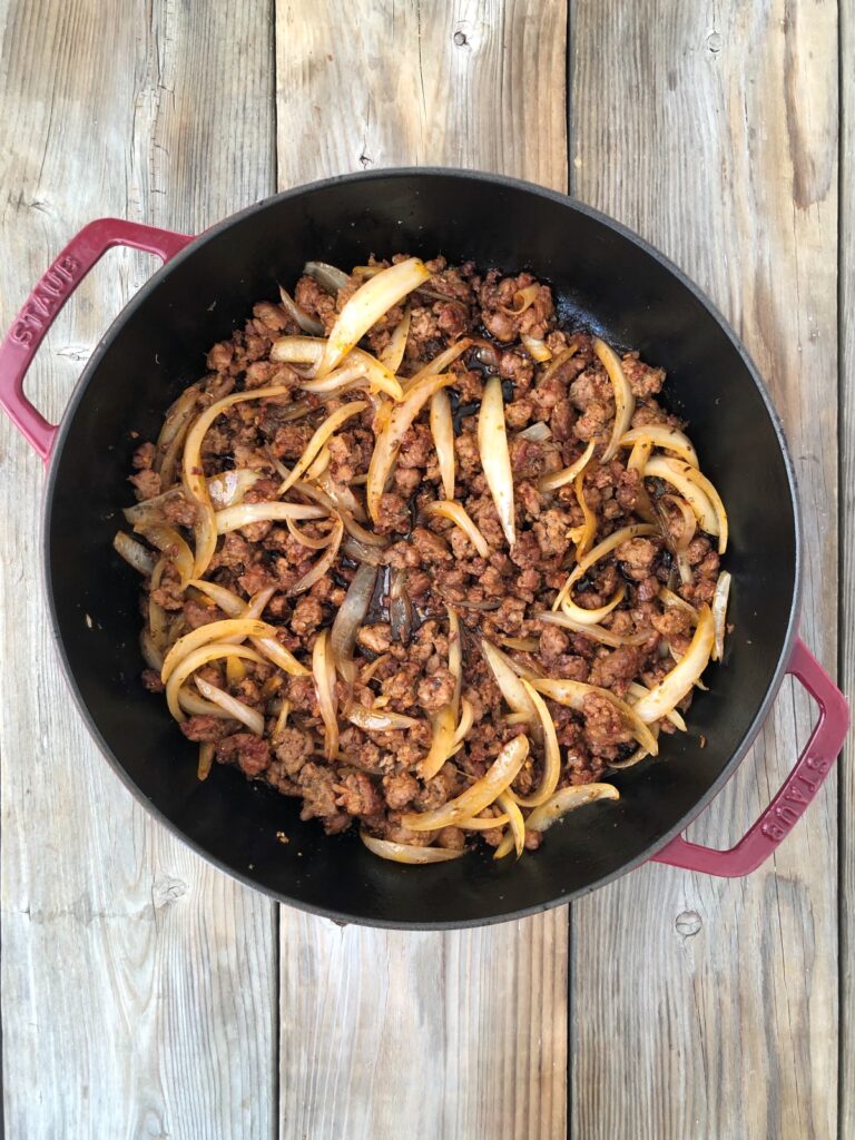 Onions, garlic, herbs and wine added to skillet and sautéed