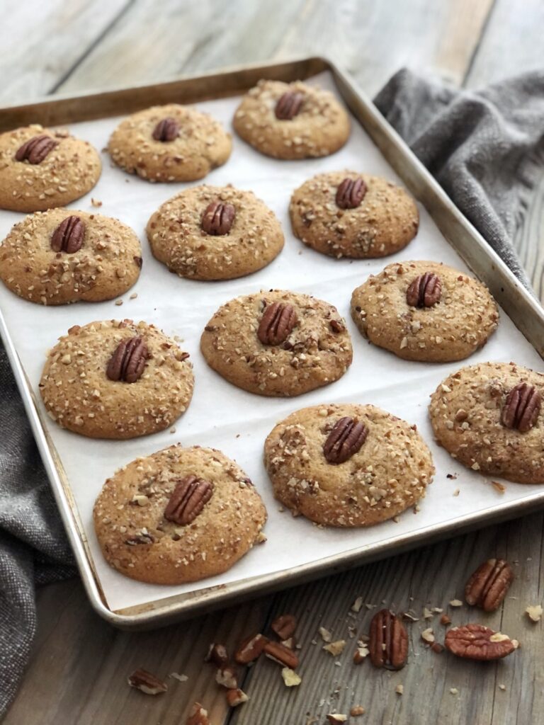 Delicious baked cookies on parchment lined baking sheet