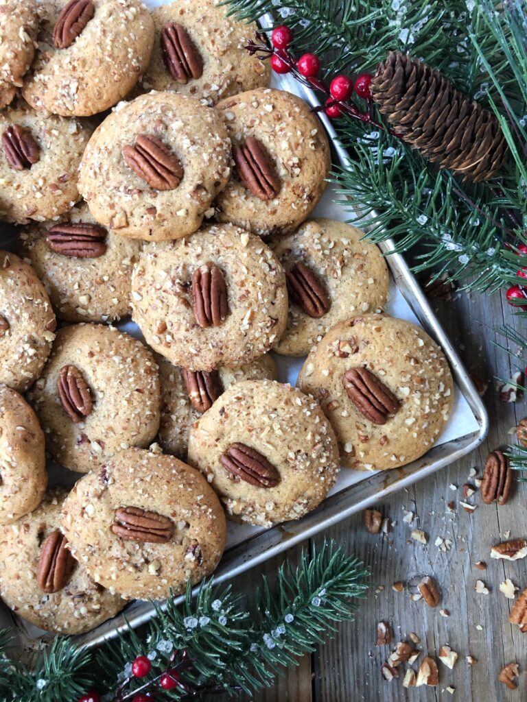 Overhead view of cookies piled on a tray being served