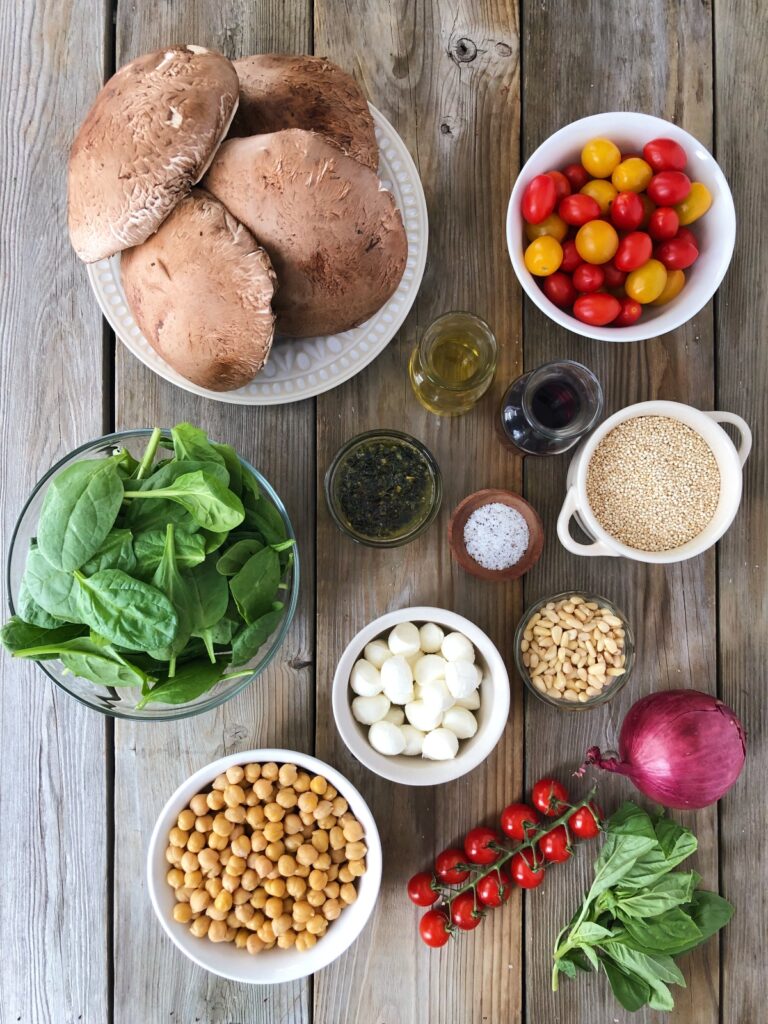 Mushrooms, tomatoes, spinach, pesto, quinoa, cheese balls, chickpeas and pine nuts.