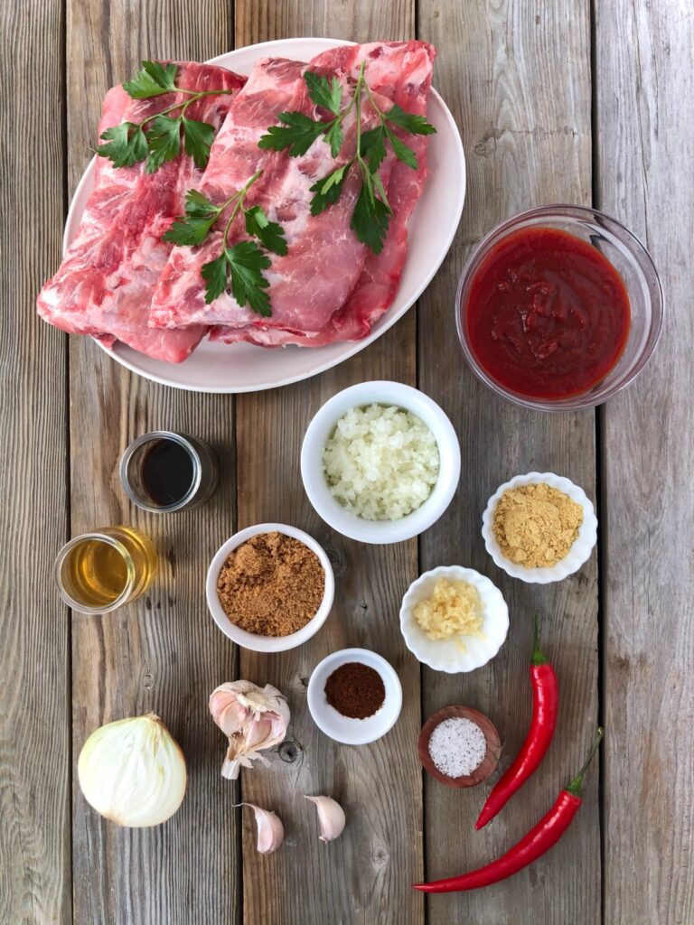 Pork back ribs, chili sauce, sugar, vinegar, Worcestershire sauce, seasonings, onion and garlic.