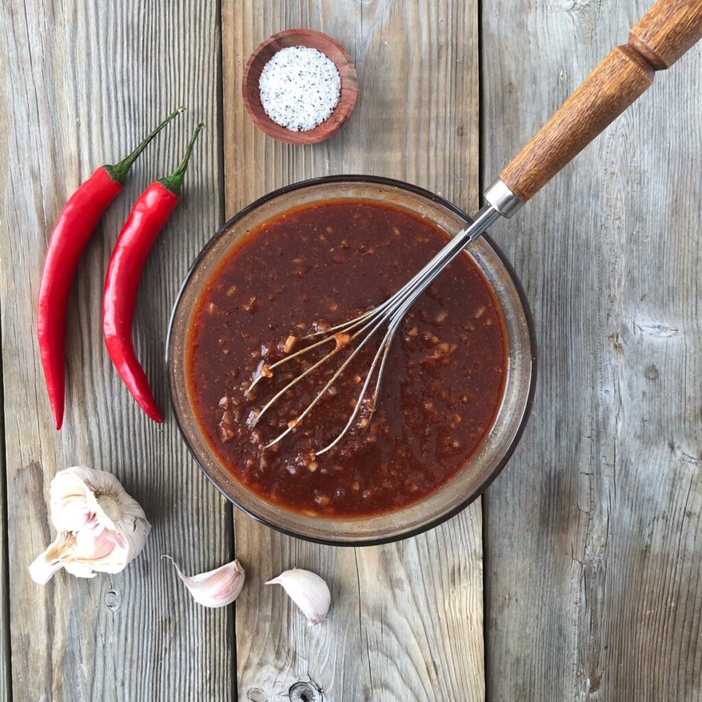 Barbecue sauce whisked together in a bowl