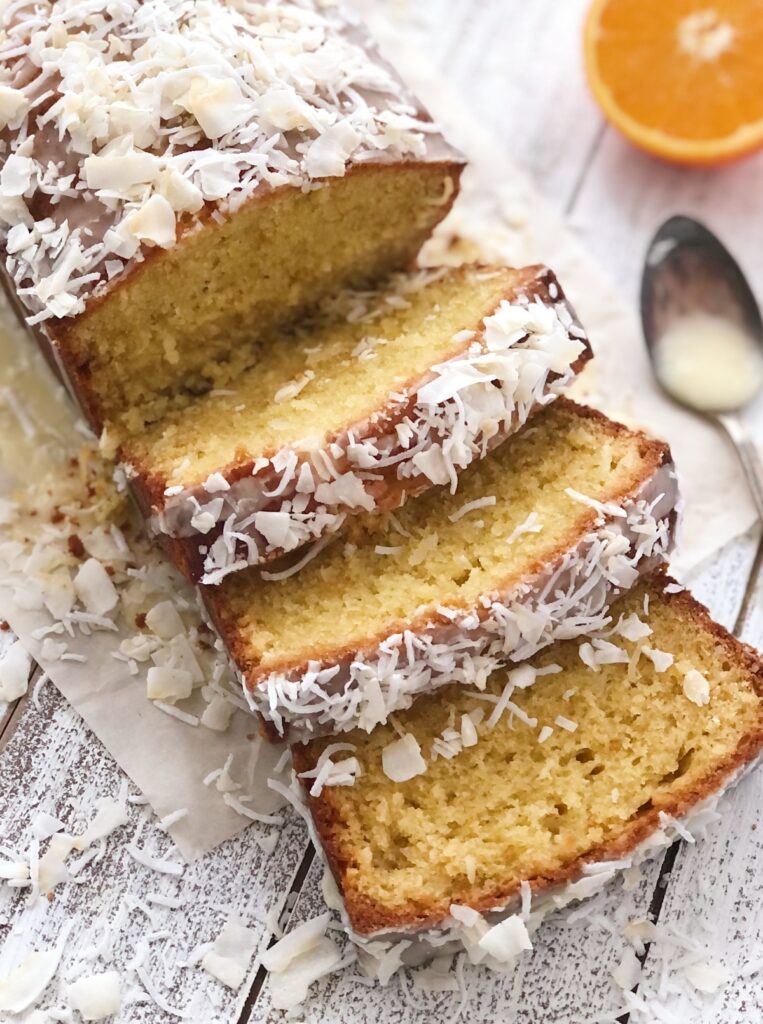 Top down view of sliced loaf with coconut scattered around.