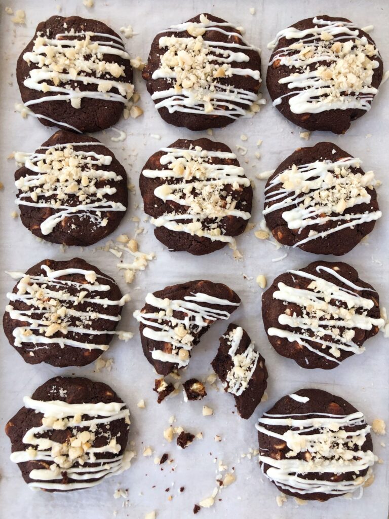 Cookies drizzled with chocolate and macadamia nuts