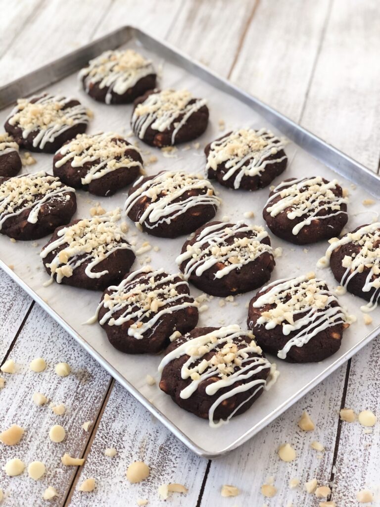 Drizzled cookies arranged on baking sheet