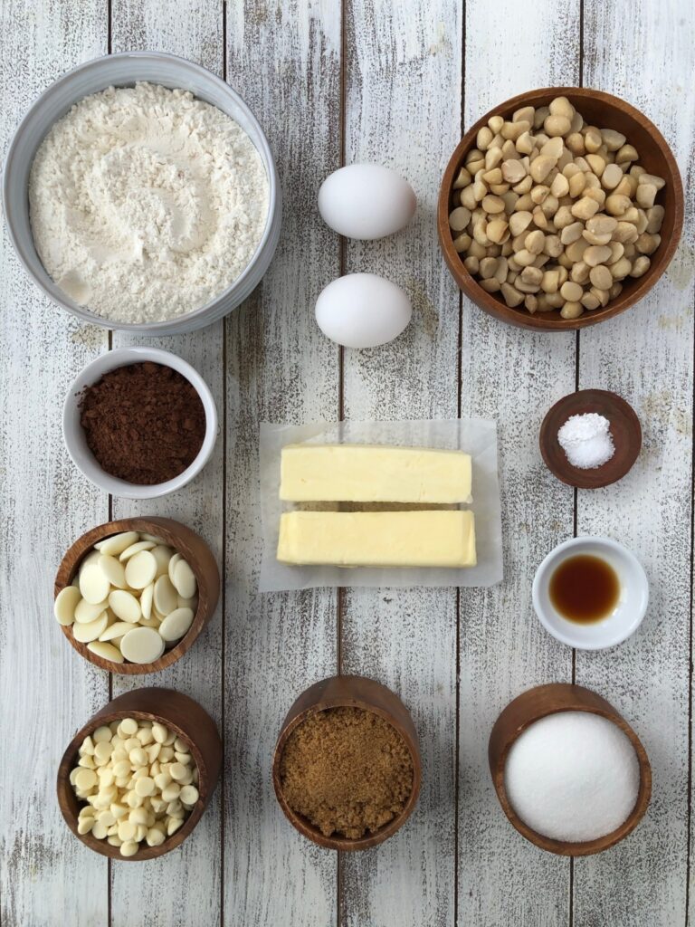 Flour, eggs, nuts, chocolate, butter, sugar, vanilla ingredients