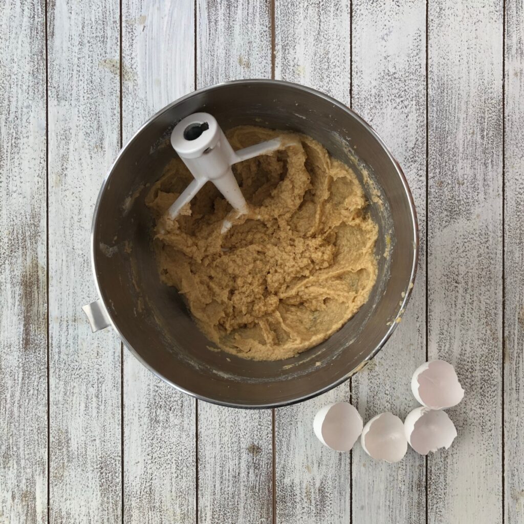 A mixing bowl with beaten wet ingredients