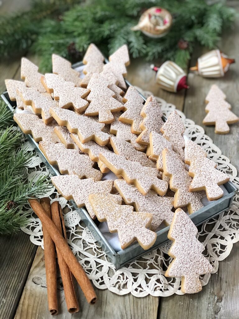 Brown sugar cinnamon cut out cookies arranged on a tray