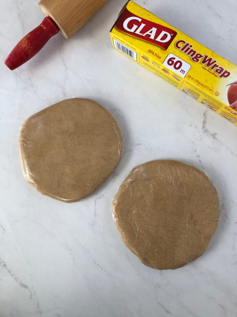 Disks of dough wrapped in plastic wrap