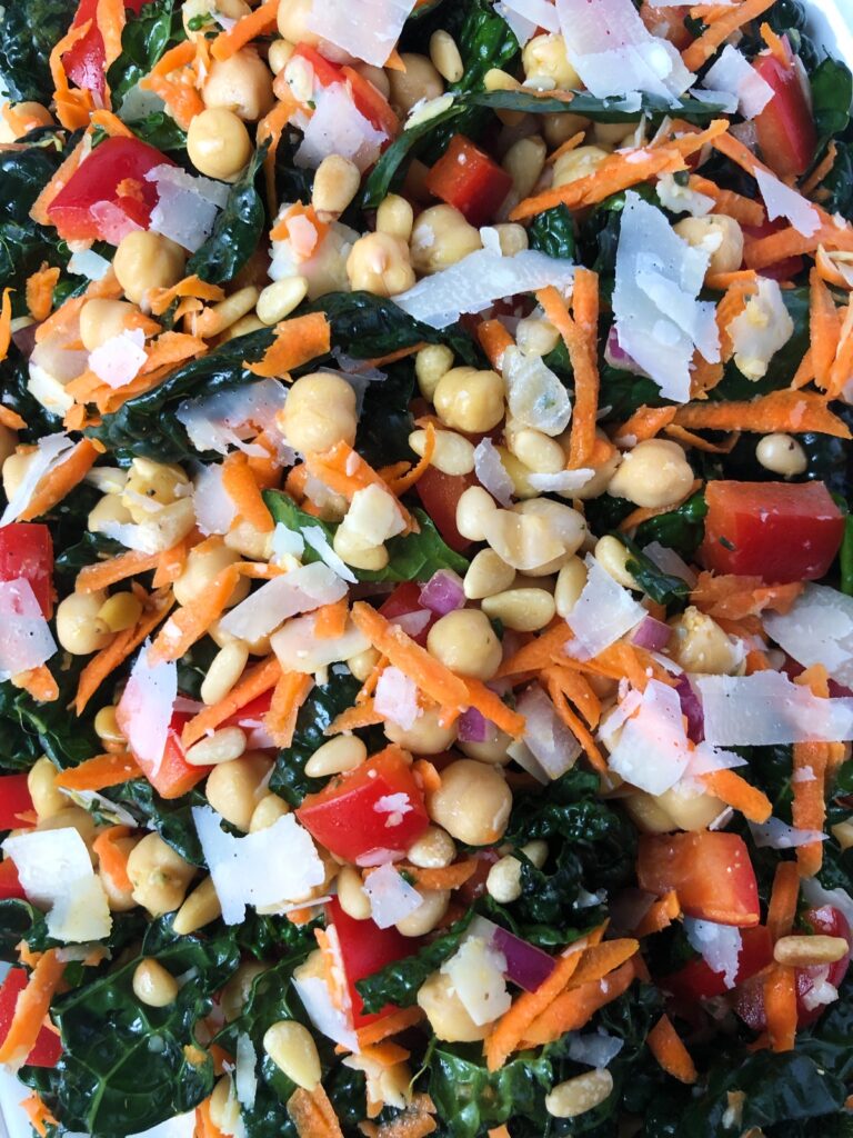 Close-up view of tossed chopped kale salad