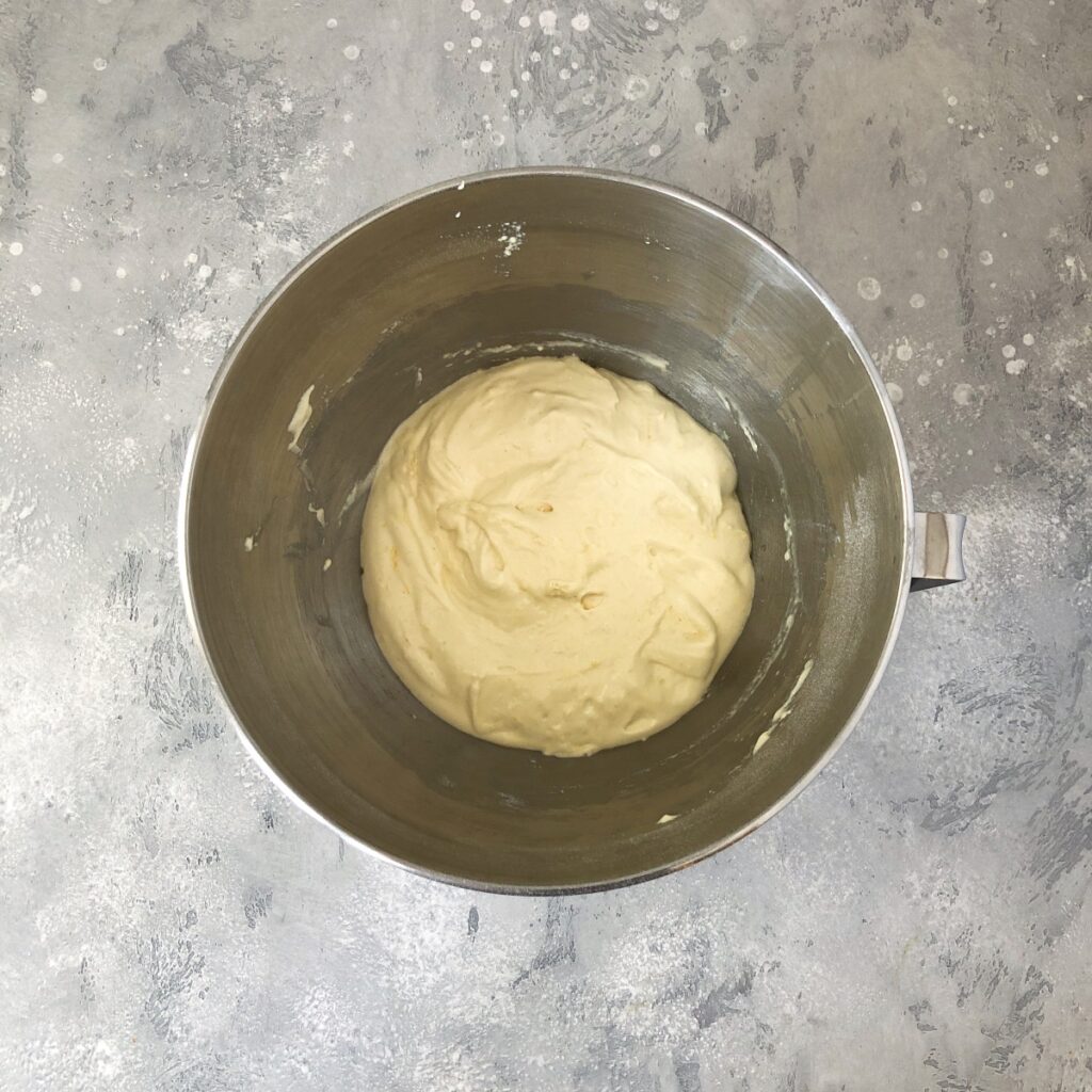 Flour added to batter and beaten in a mixing bowl.