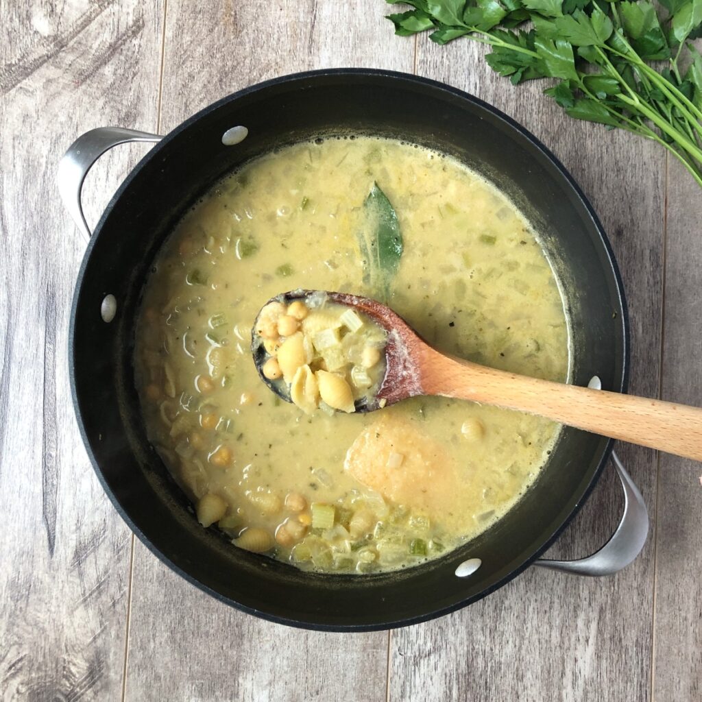 Pasta partially cooked in the Dutch oven.