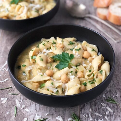 Square image of bowl of pasta e ceci soup.