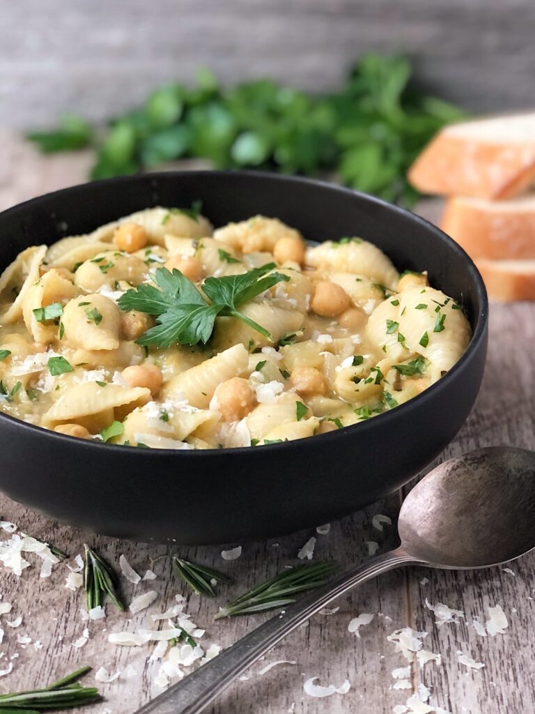 Pasta e Ceci Italian chickpea soup in a bowl with a spoon.