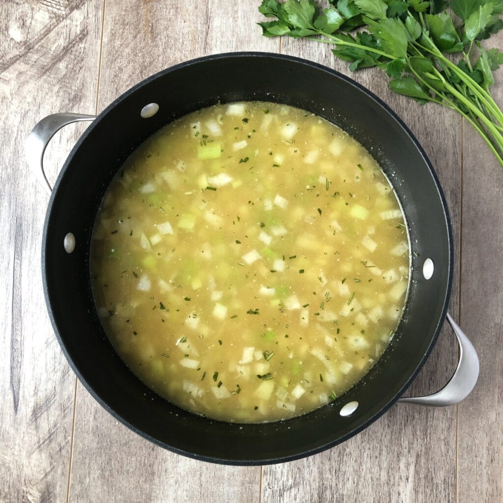 Broth and chickpeas added to Dutch oven.