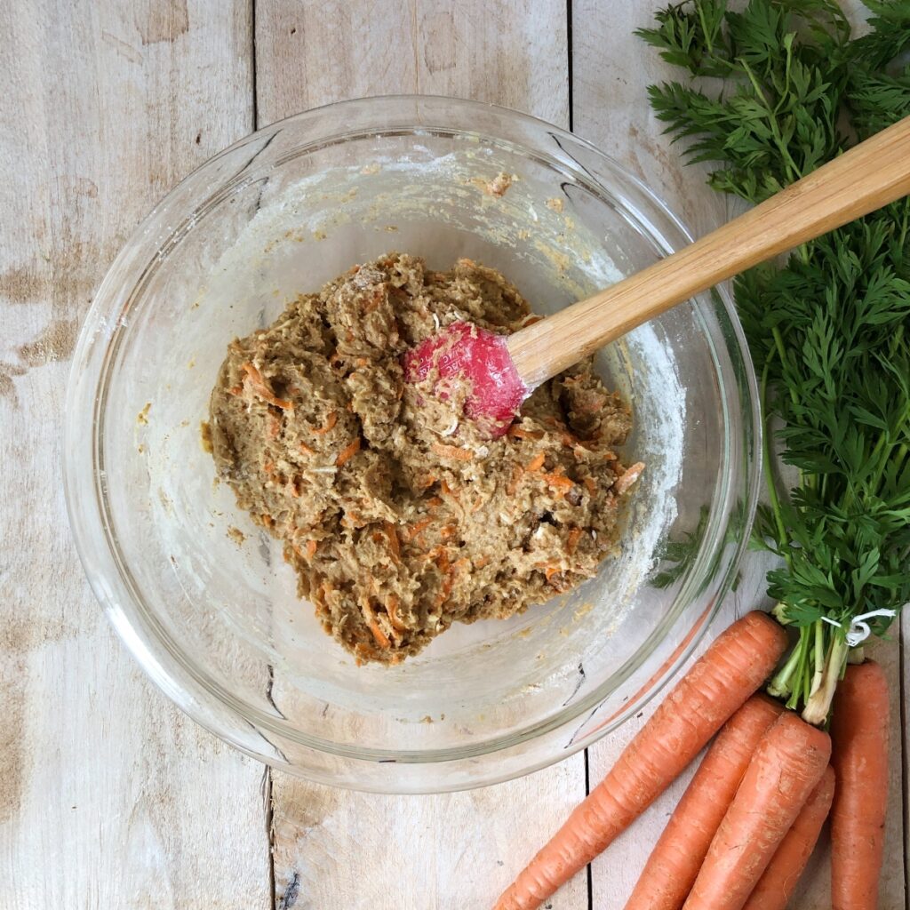 Dry ingredients stirred into carrot batter.