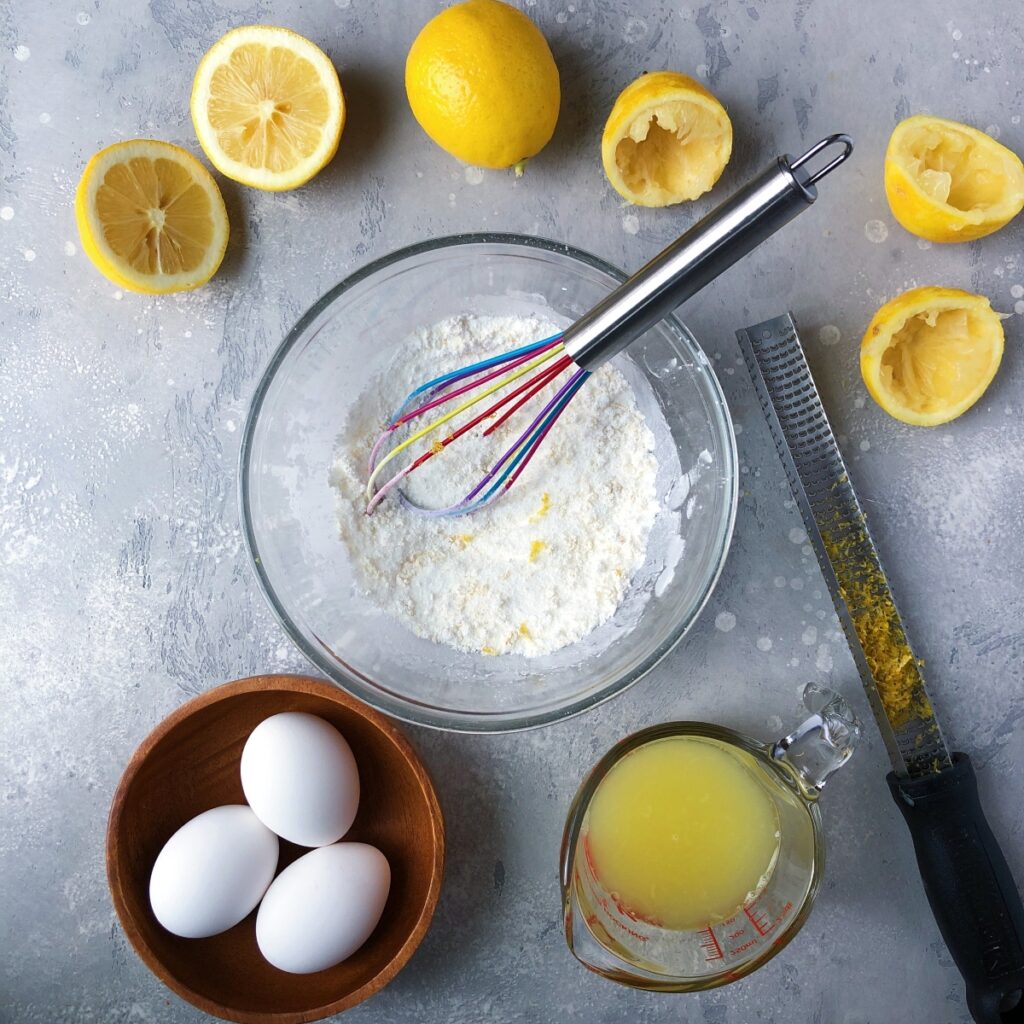 Sugar, cornstarch and lemon zest being whisked.